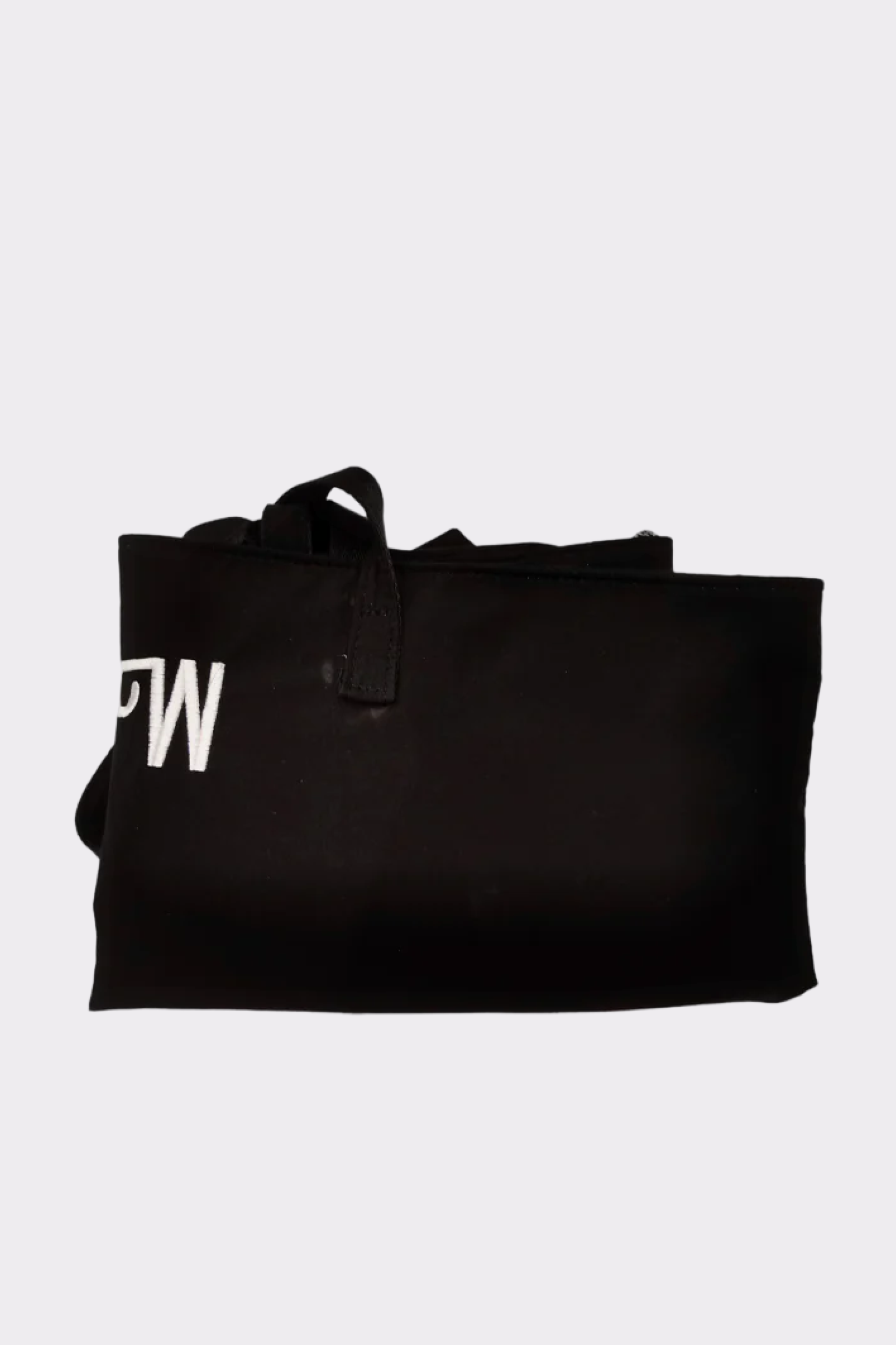 The Urban Slate Waterproof Bag is a black zippered fabric pouch with a small strap, ideal for organizing gym or travel items. White letters appear on the left side. The bag is shown partially folded on a plain light gray background.