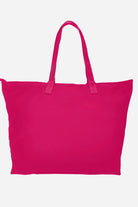 A large, vibrant Barbara Pink waterproof travel bag called "The One" by looselyboho is displayed against a plain white background. The bag features reinforced handles, a simple and unadorned design, and appears spacious.